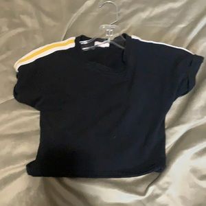 black crop top with white and yellow strips